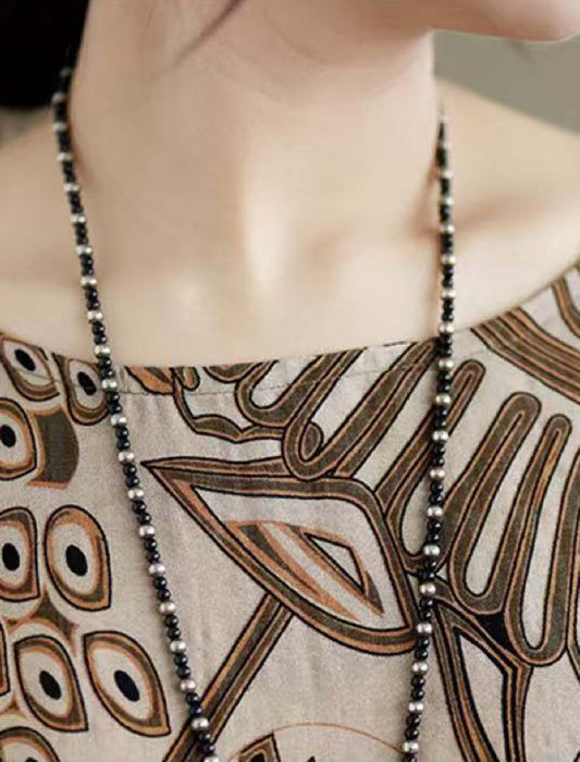 ボタニカルチュニック丈ブラウス